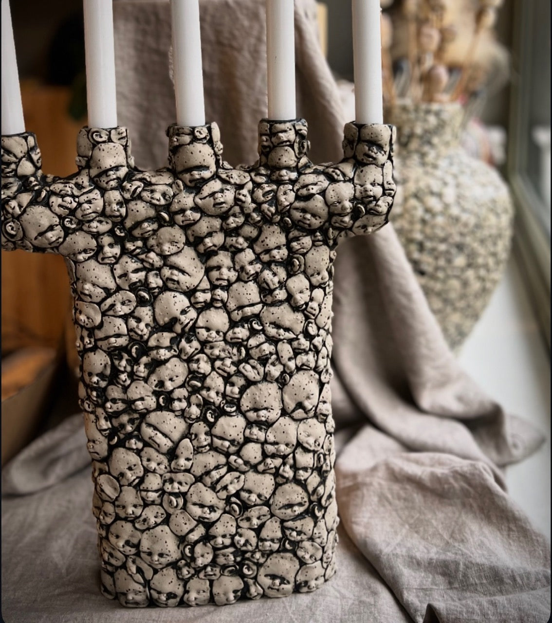 Kandelaber Små ansikten